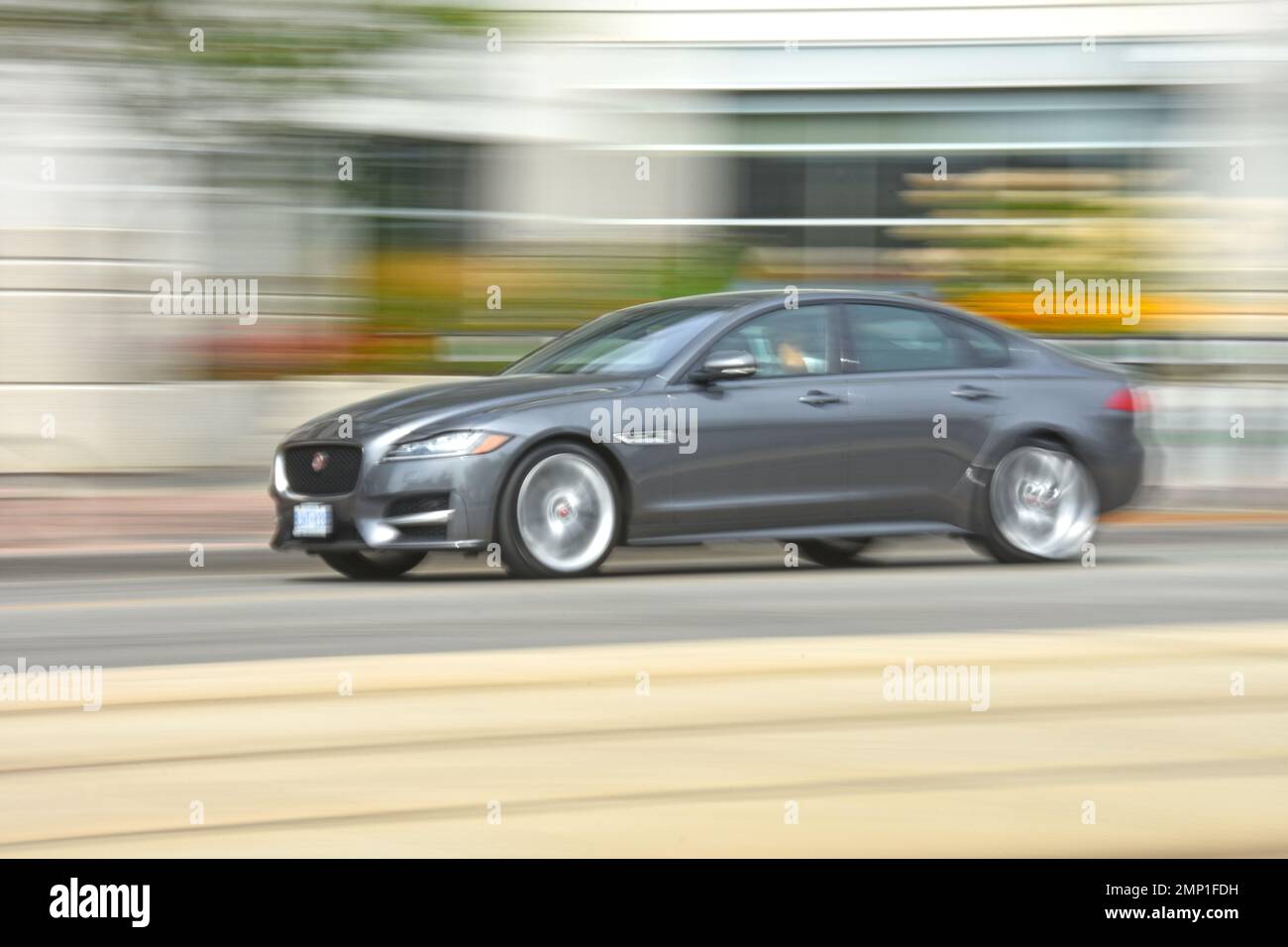 Car moving blurred motion Stock Photo Alamy