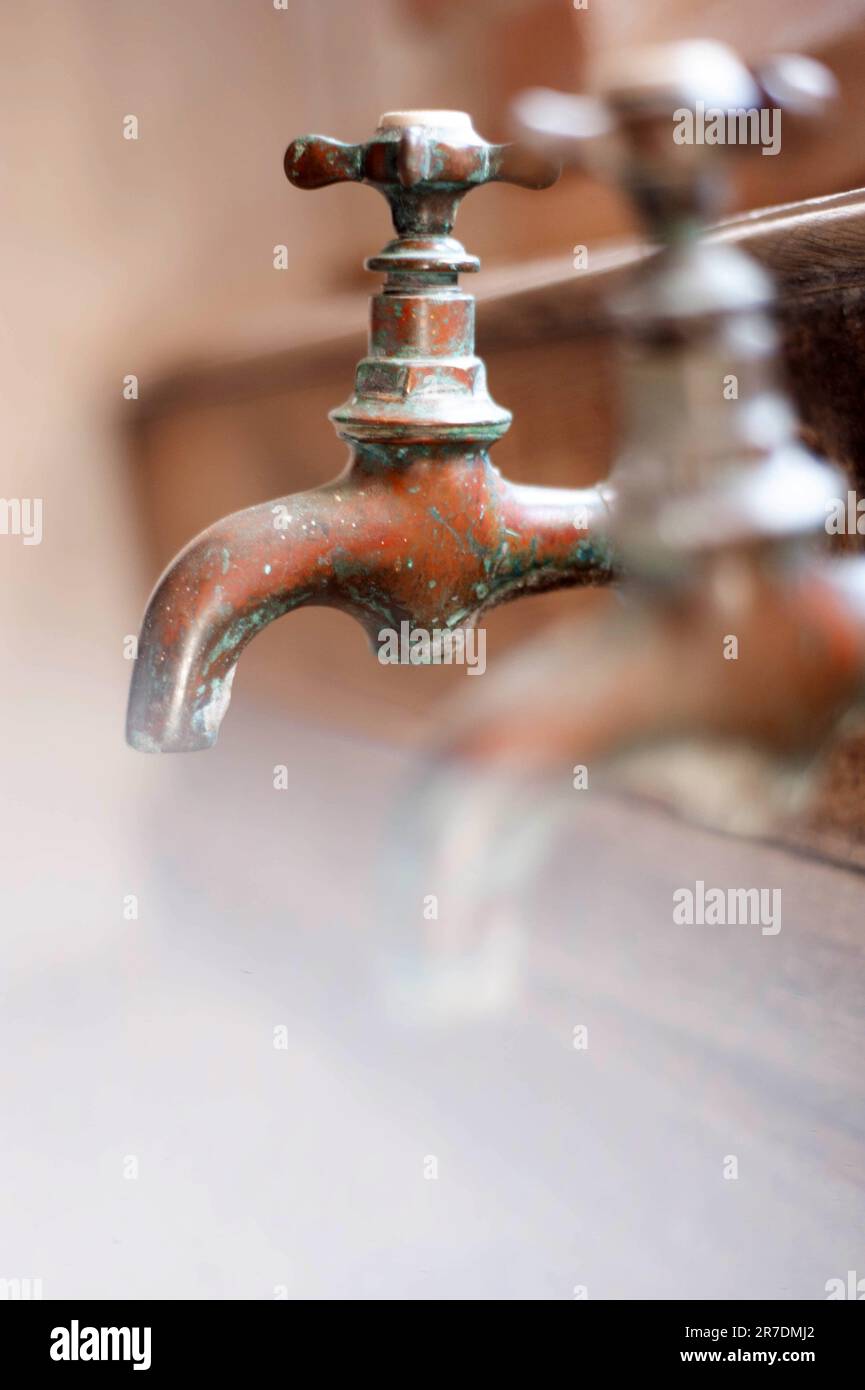 Two old brass taps Stock Photo Alamy