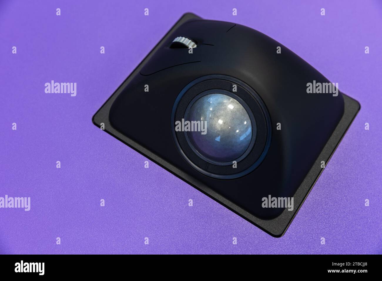 Builtin tabletop input device, black trackball mouse, a pointing