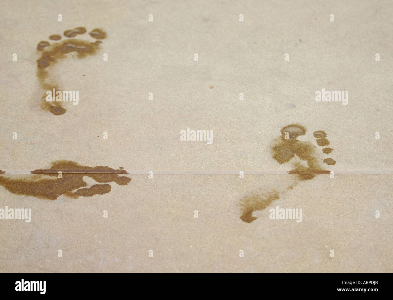 Footprints next to pool Stock Photo Alamy