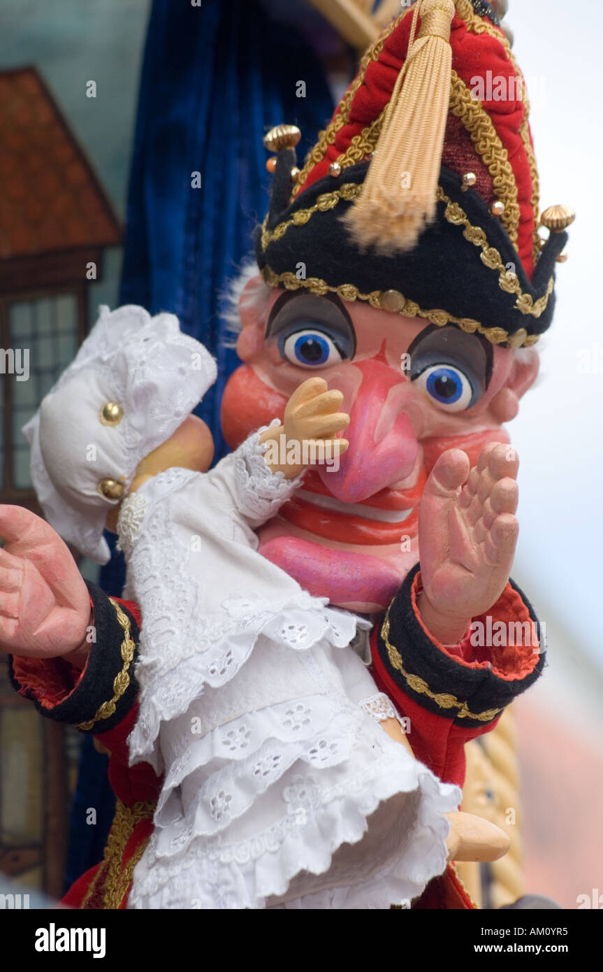 Punch and Judy puppet holding baby Stock Photo Alamy