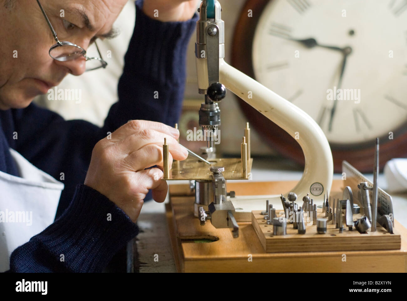 Man repairs clock Stock Photo Alamy