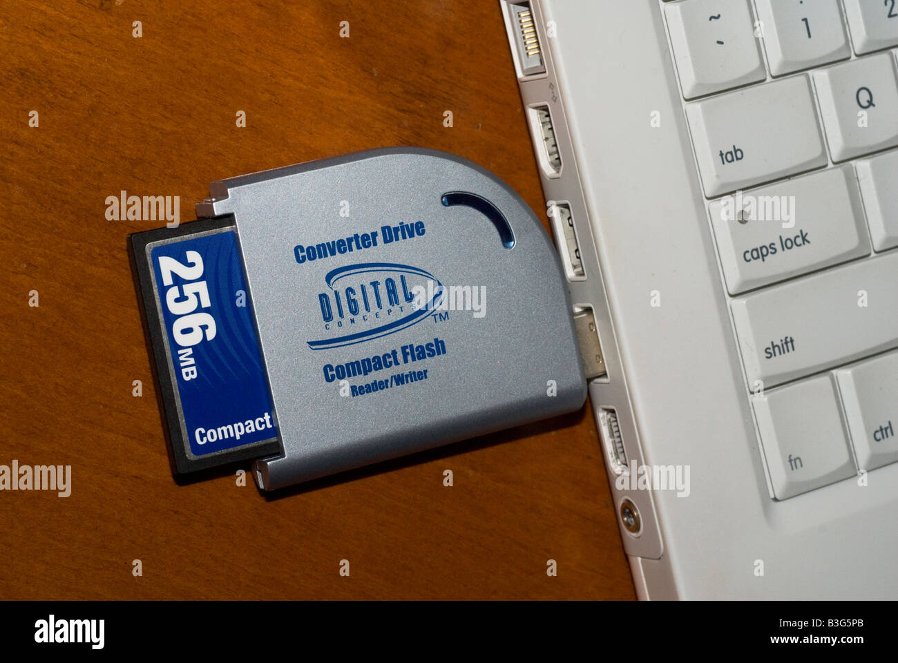 Compact flash memory card in card reader attached to a computer Stock