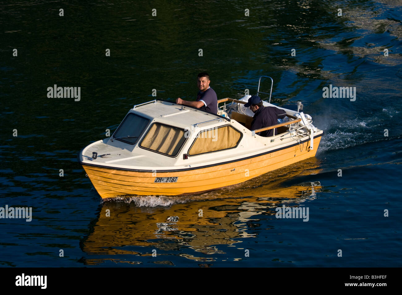 yellow motor boat Stock Photo Alamy