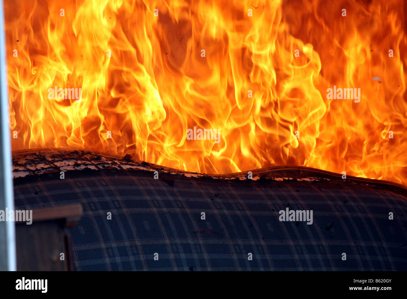 A couch on fire Stock Photo Alamy