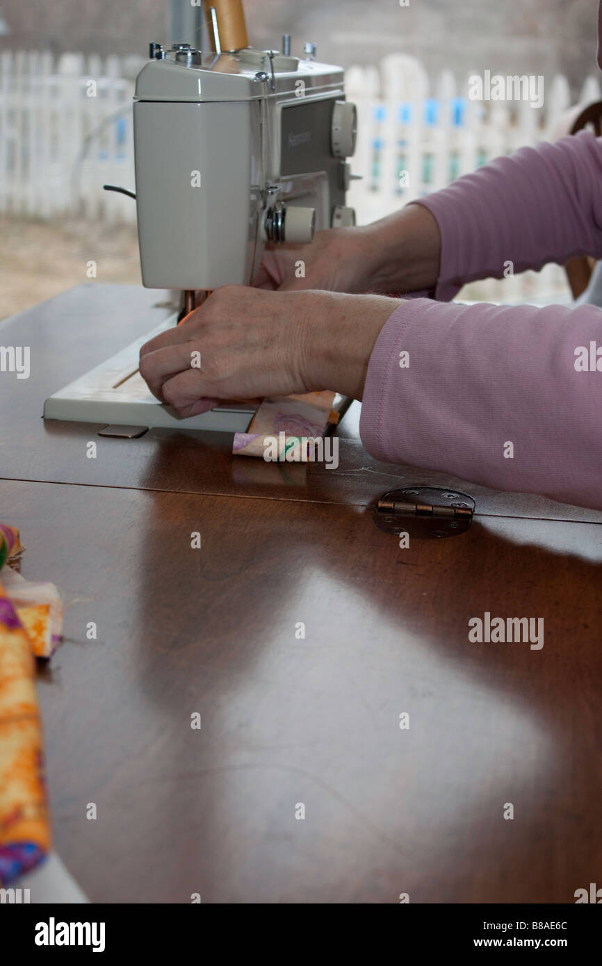 Using the sewing Machine Stock Photo Alamy