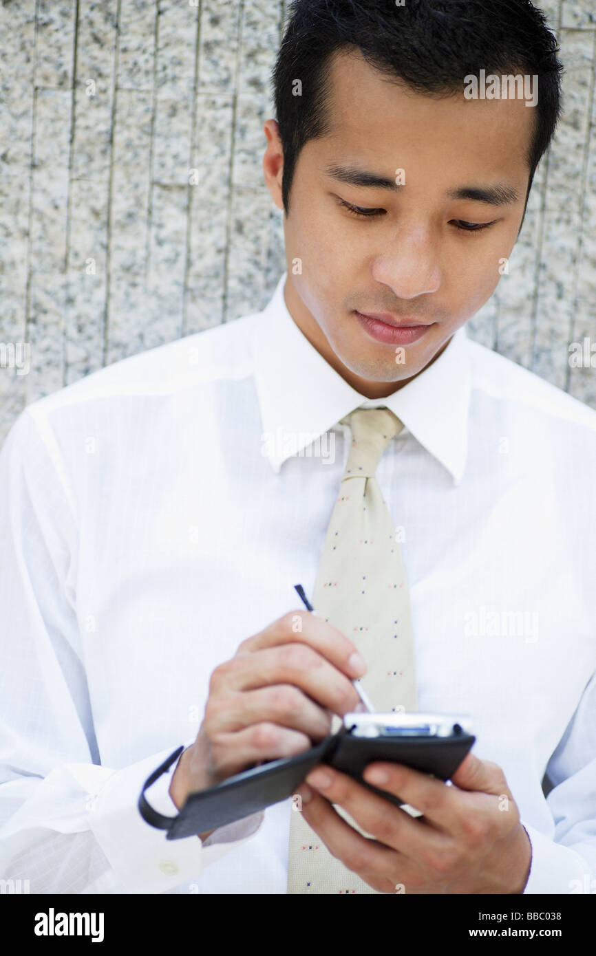 Executive using PDA Stock Photo Alamy