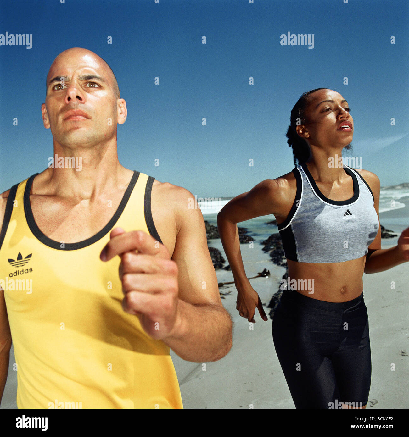 Runners on beach Stock Photo Alamy