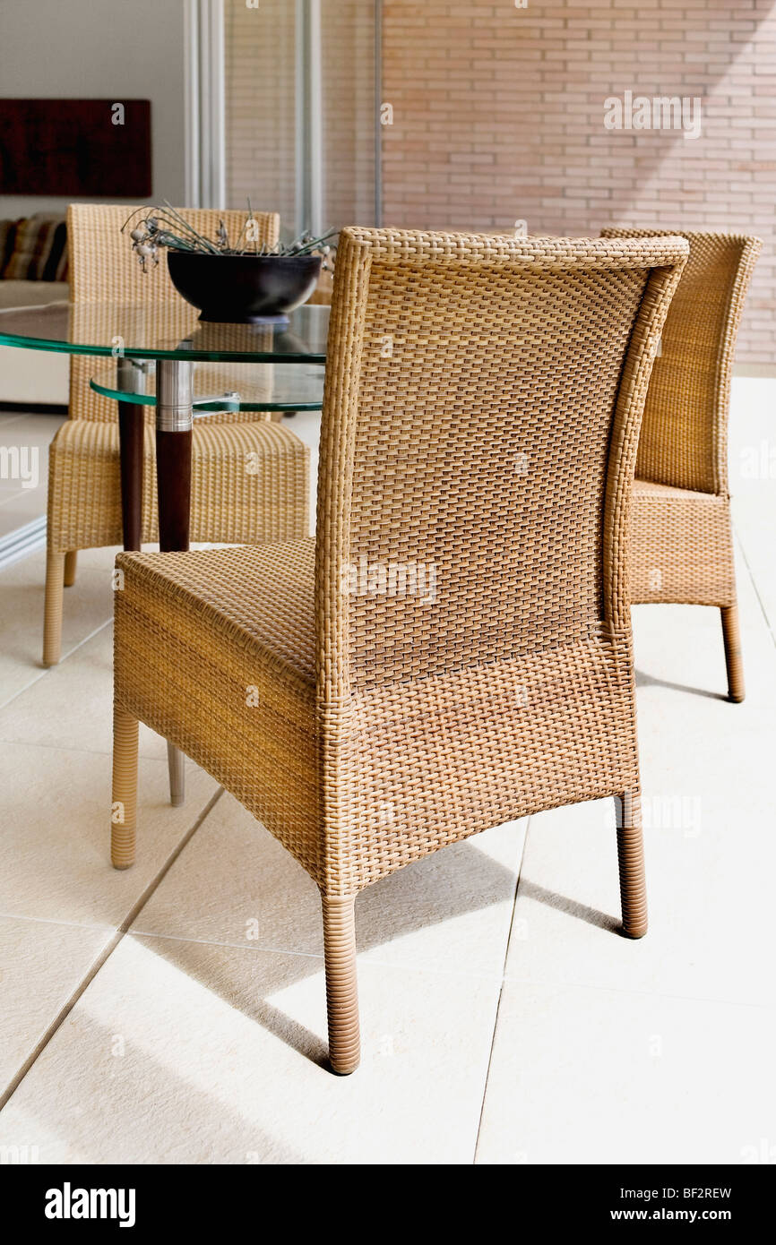 Wicker chairs with a table Stock Photo Alamy