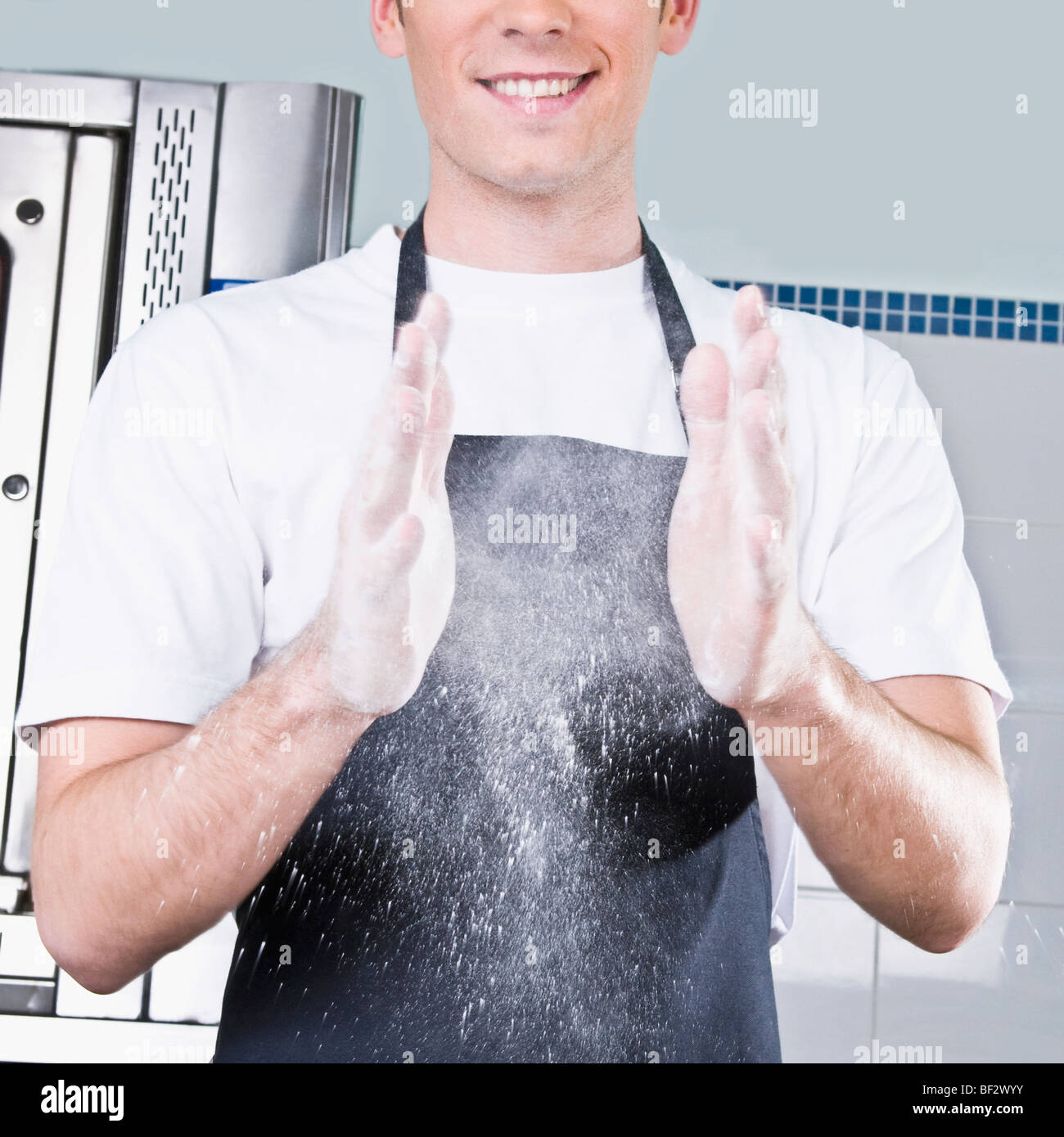Chef dusting hands with flour hires stock photography and images Alamy