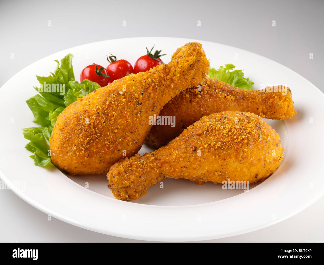 Deep fried breaded chicken drumsticks hires stock photography and