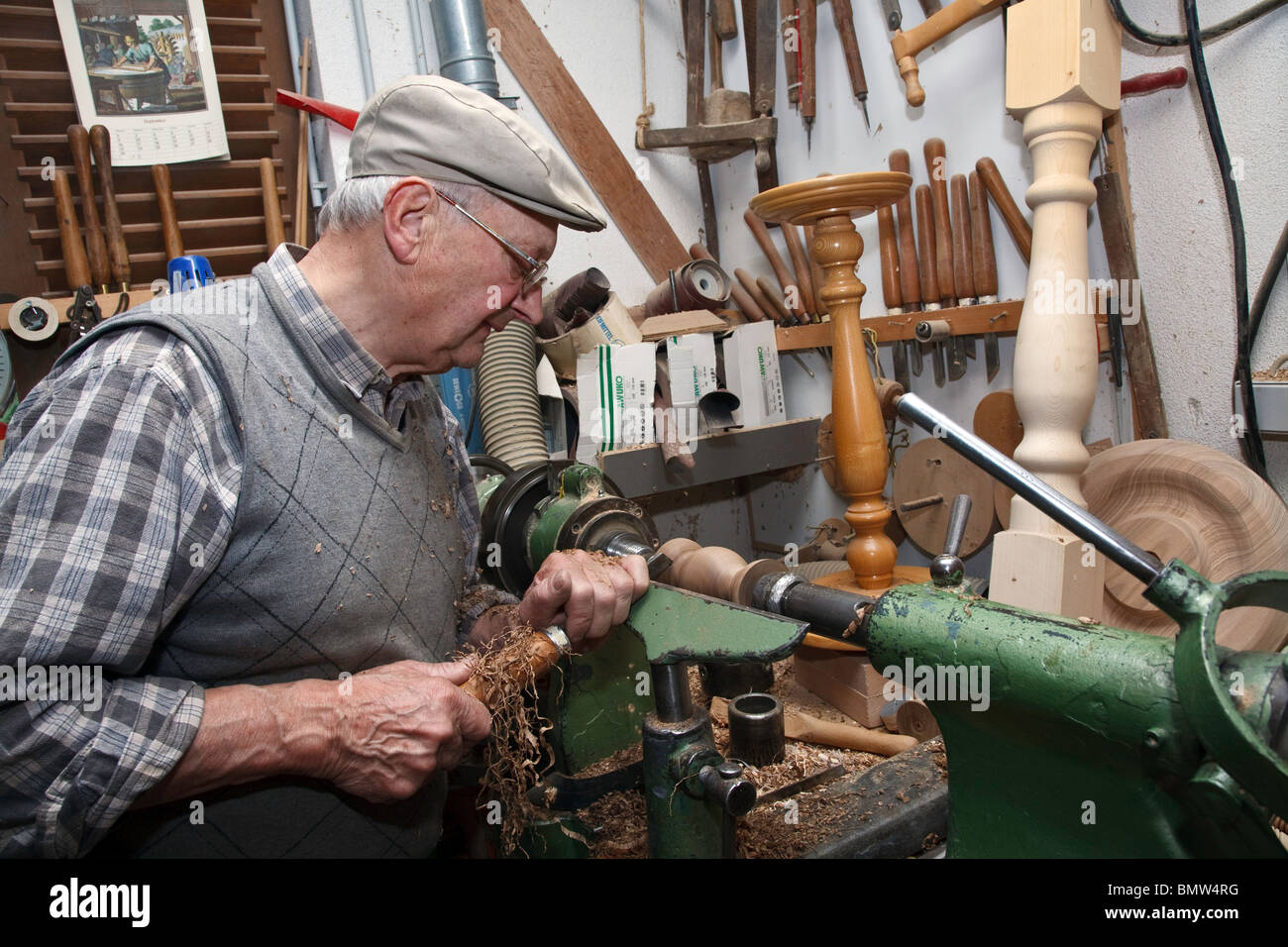 Master Woodturning man working on lathe with chisel turning and(04)