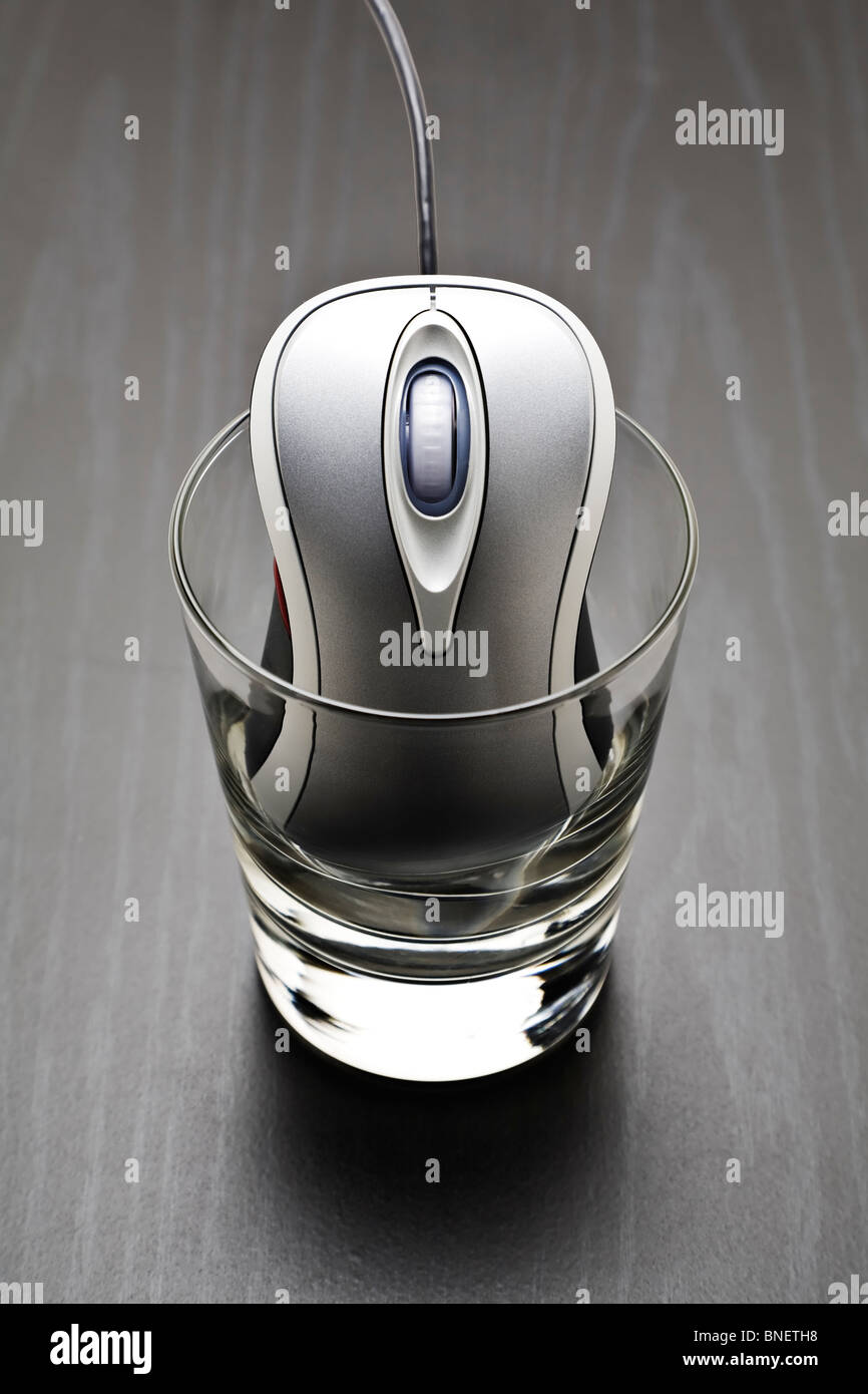 Computer mouse in a glass Stock Photo Alamy