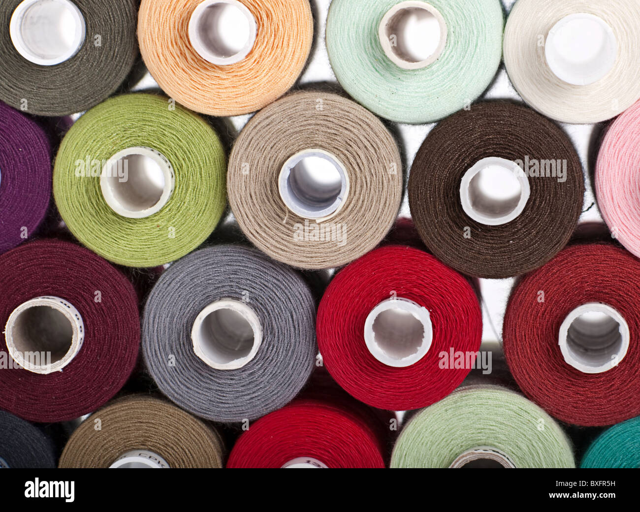 Color sewing thread on bobbin closeup view hires stock photography and