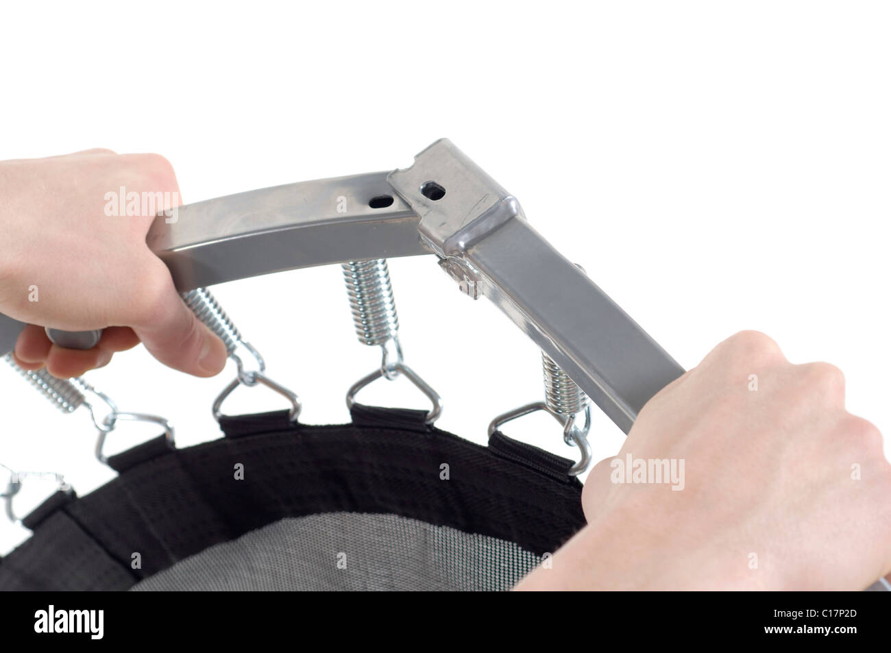 Hands assembling foldable trampoline Stock Photo Alamy