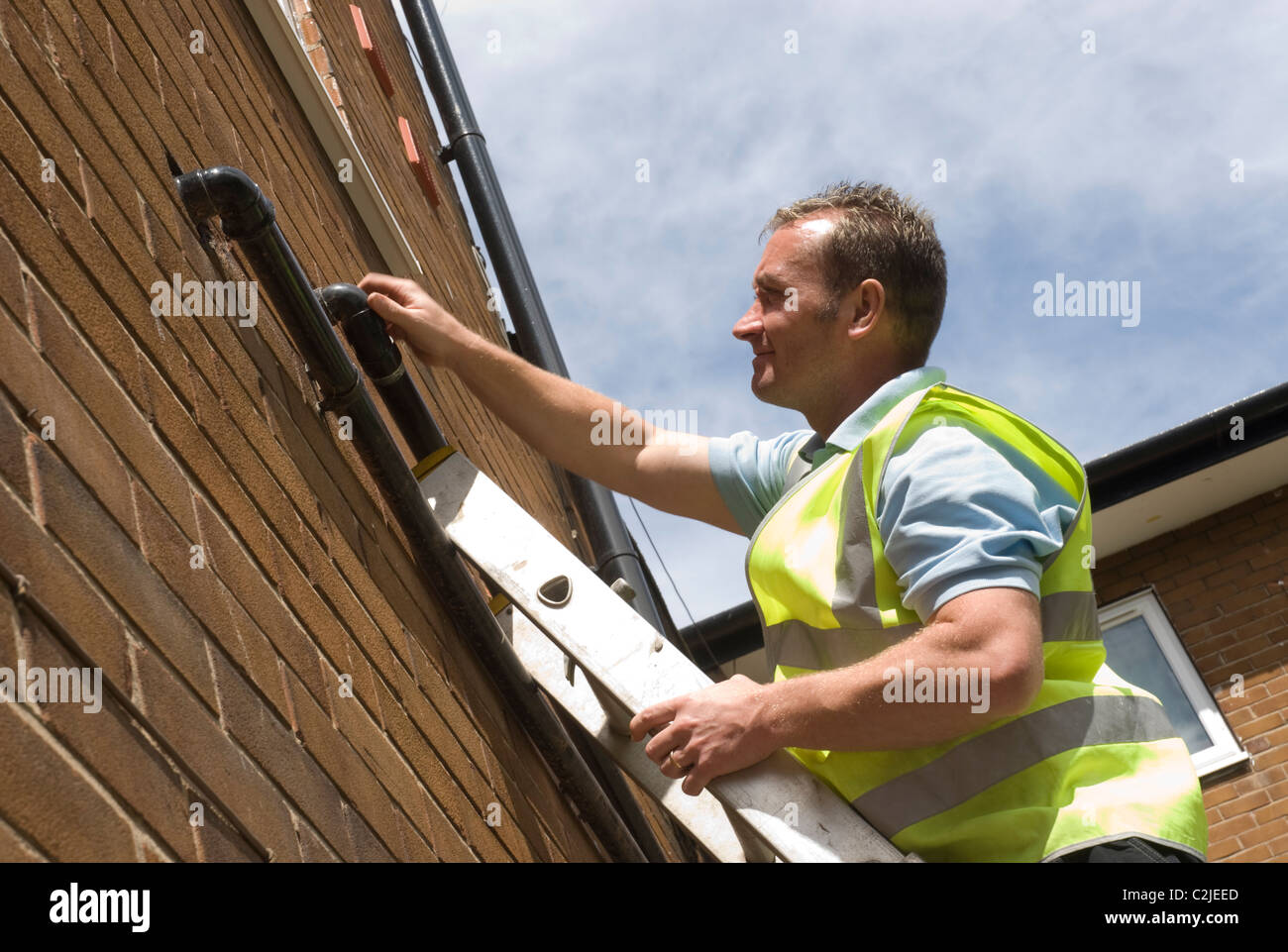 Installing and checking external plumbing pipework Stock Photo Alamy