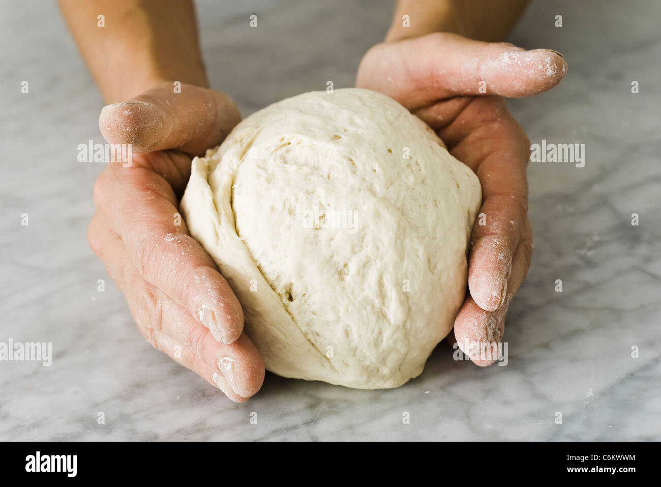 Forming basic bread dough into a ball Stock Photo Alamy