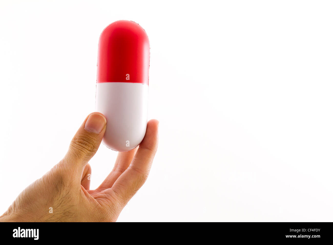a large capsule representing big pharma Stock Photo Alamy