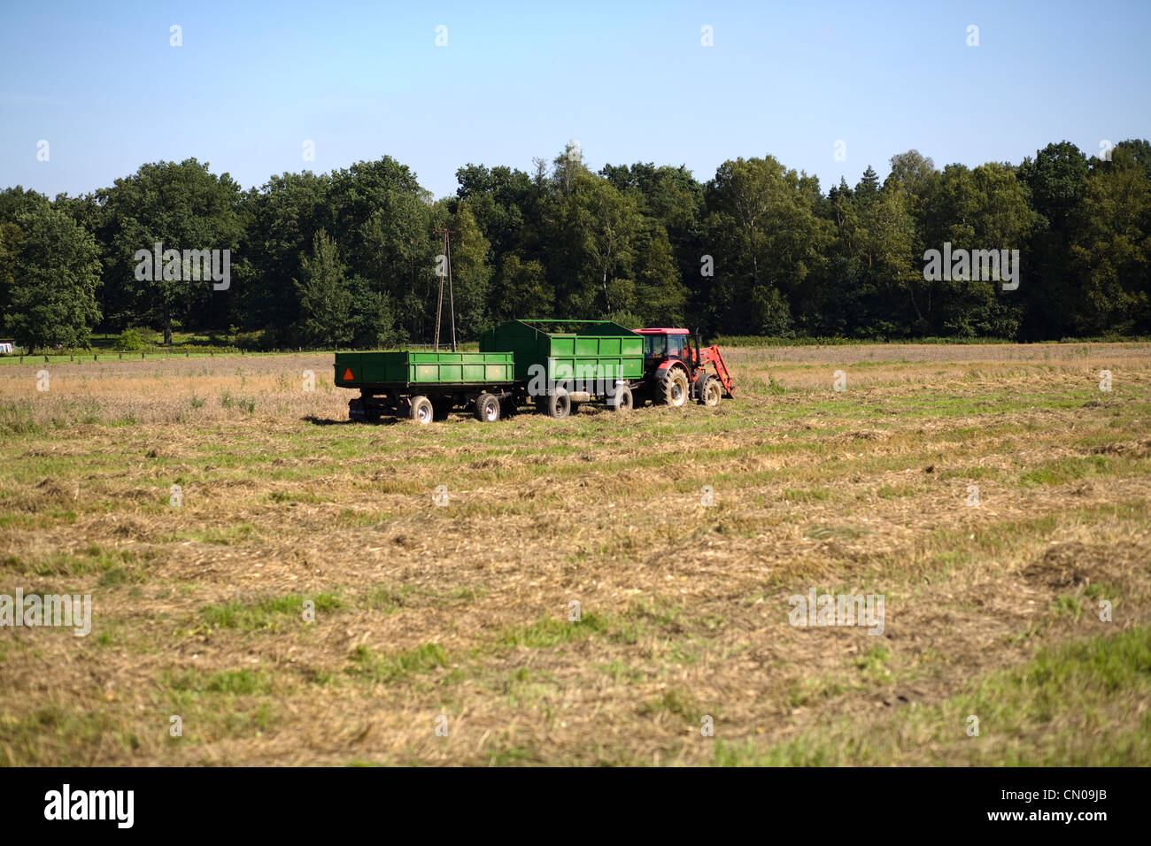 Tractor with two trailers Stock Photo Alamy