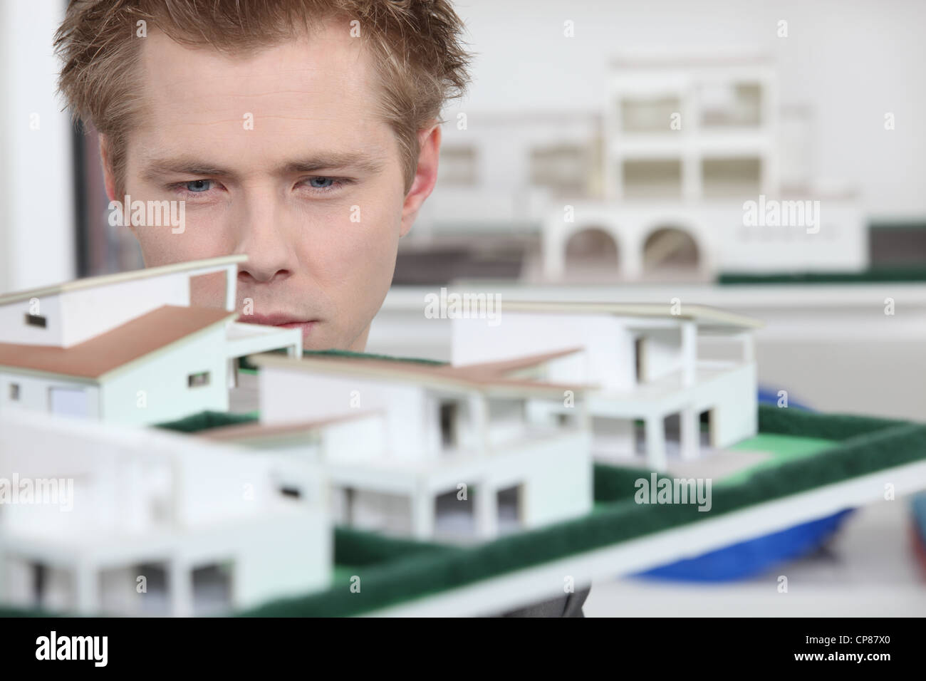 Property developer inspecting model Stock Photo Alamy
