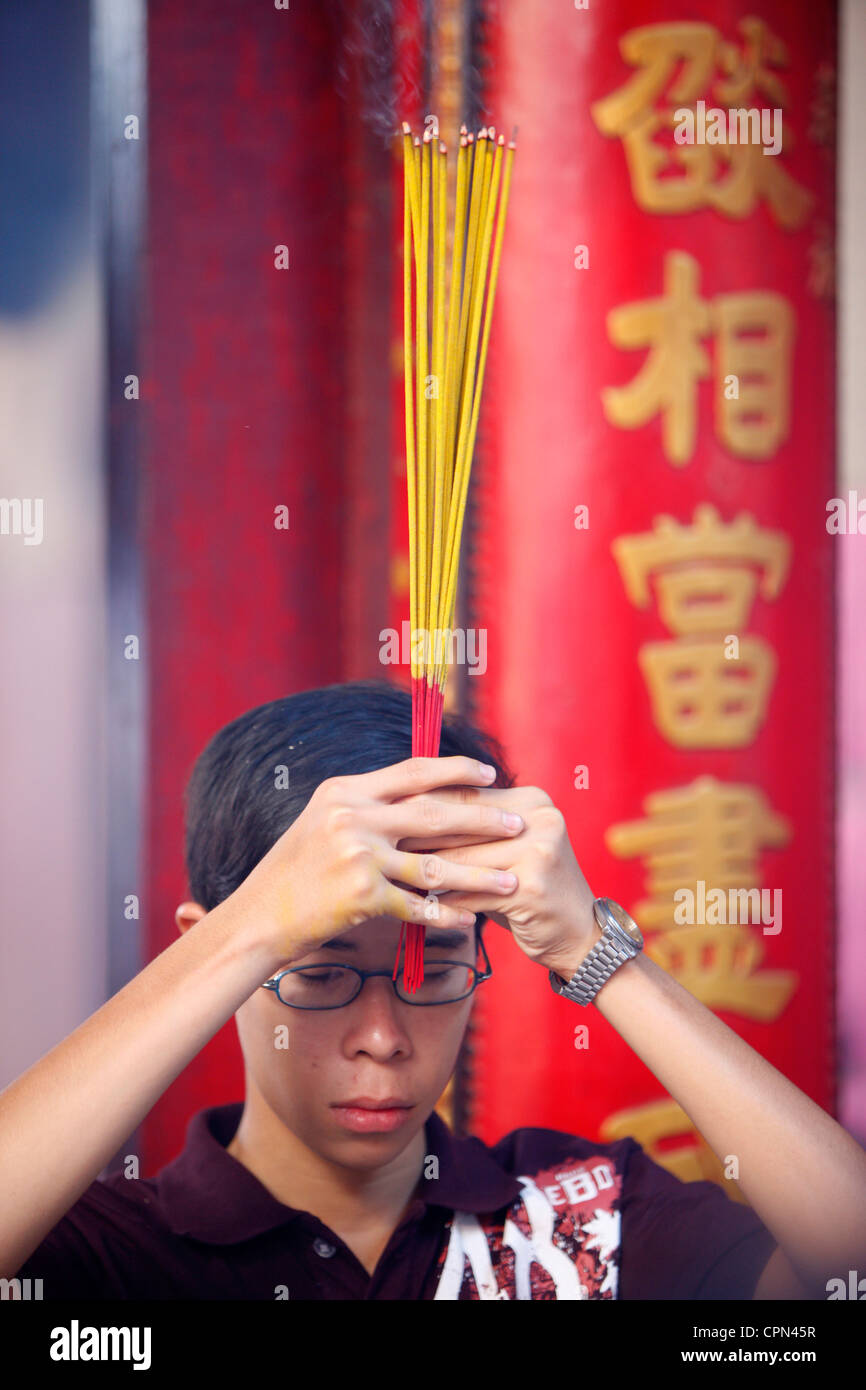 Buddhist child with incense hires stock photography and images Alamy