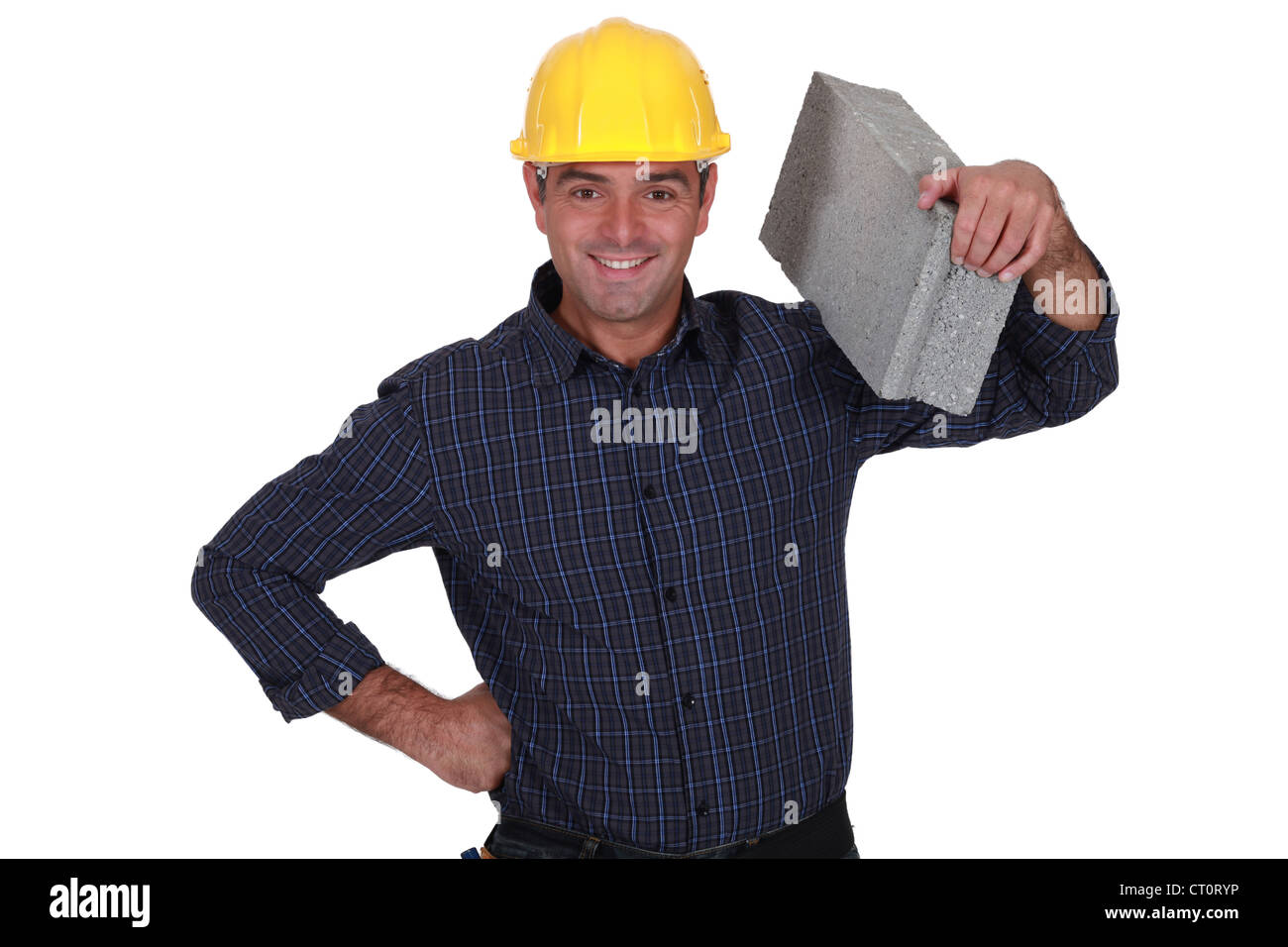 mason holding brick Stock Photo Alamy