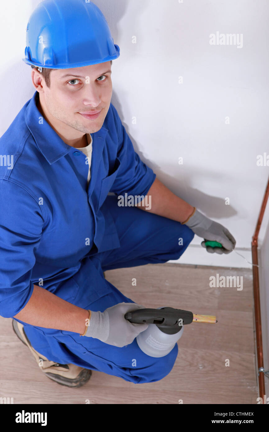 Plumber soldering pipe Stock Photo Alamy