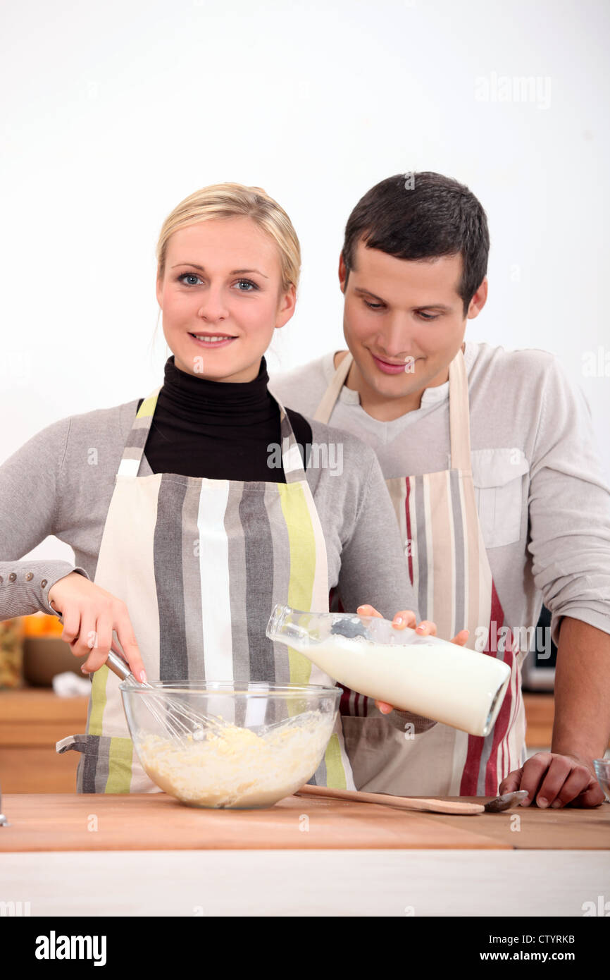 Couple baking together Stock Photo Alamy