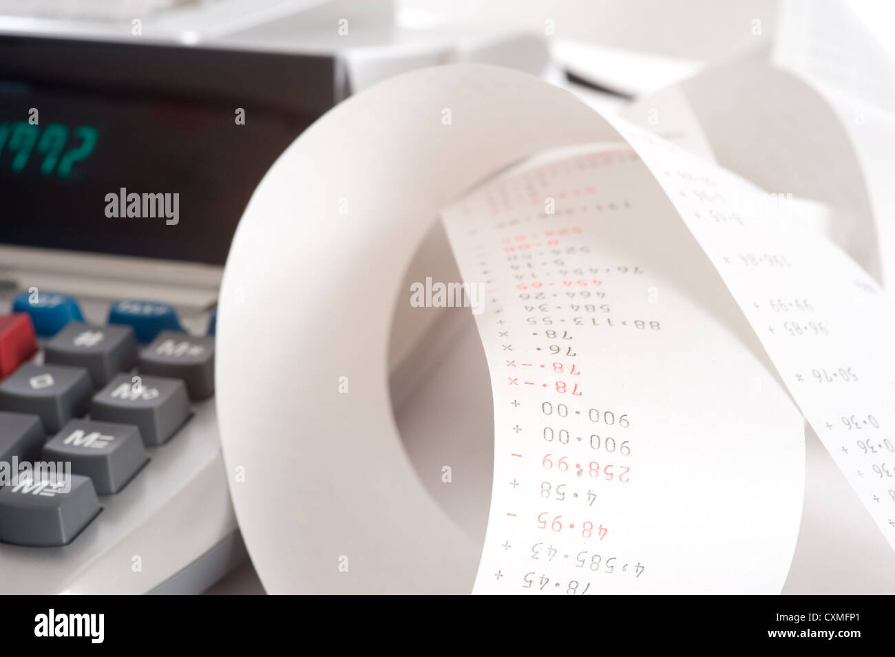 An adding machine or calculator with adding machine tape or paper Stock Photo Alamy