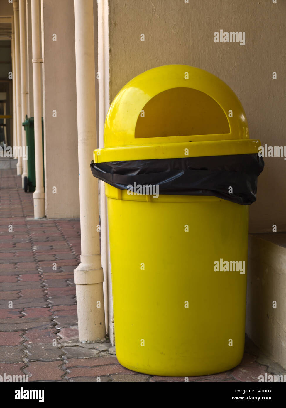 Yellow plastic bin Stock Photo Alamy