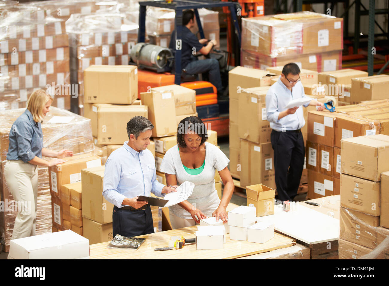 Workers In Warehouse Preparing Goods For Dispatch Stock Photo Alamy