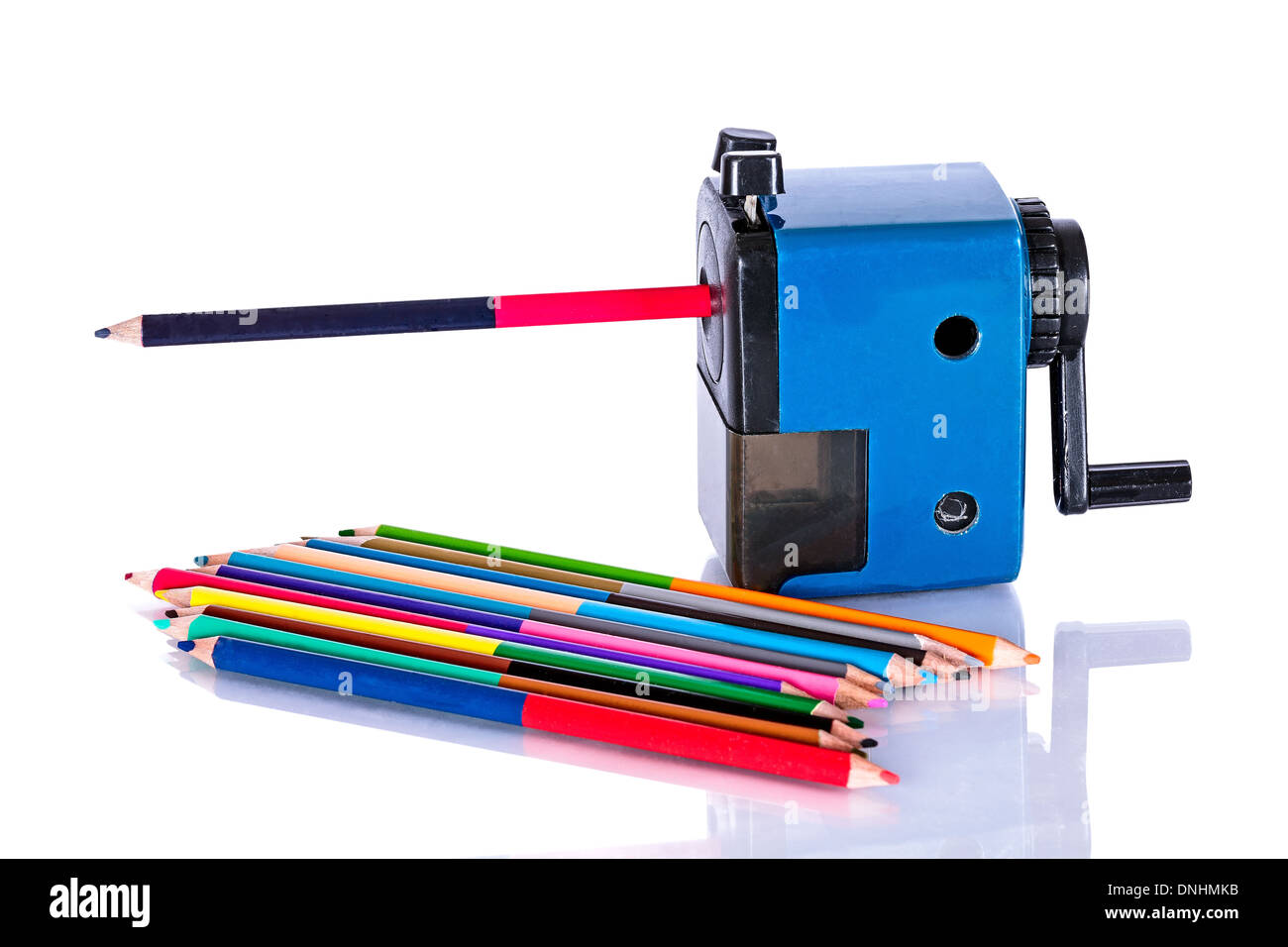 Colored pencils with sharpener for them Stock Photo Alamy