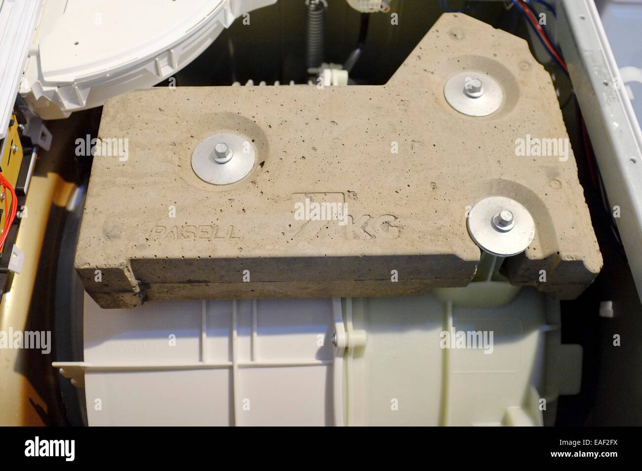 washing machine internal stabilizing concrete weight Stock Photo Alamy