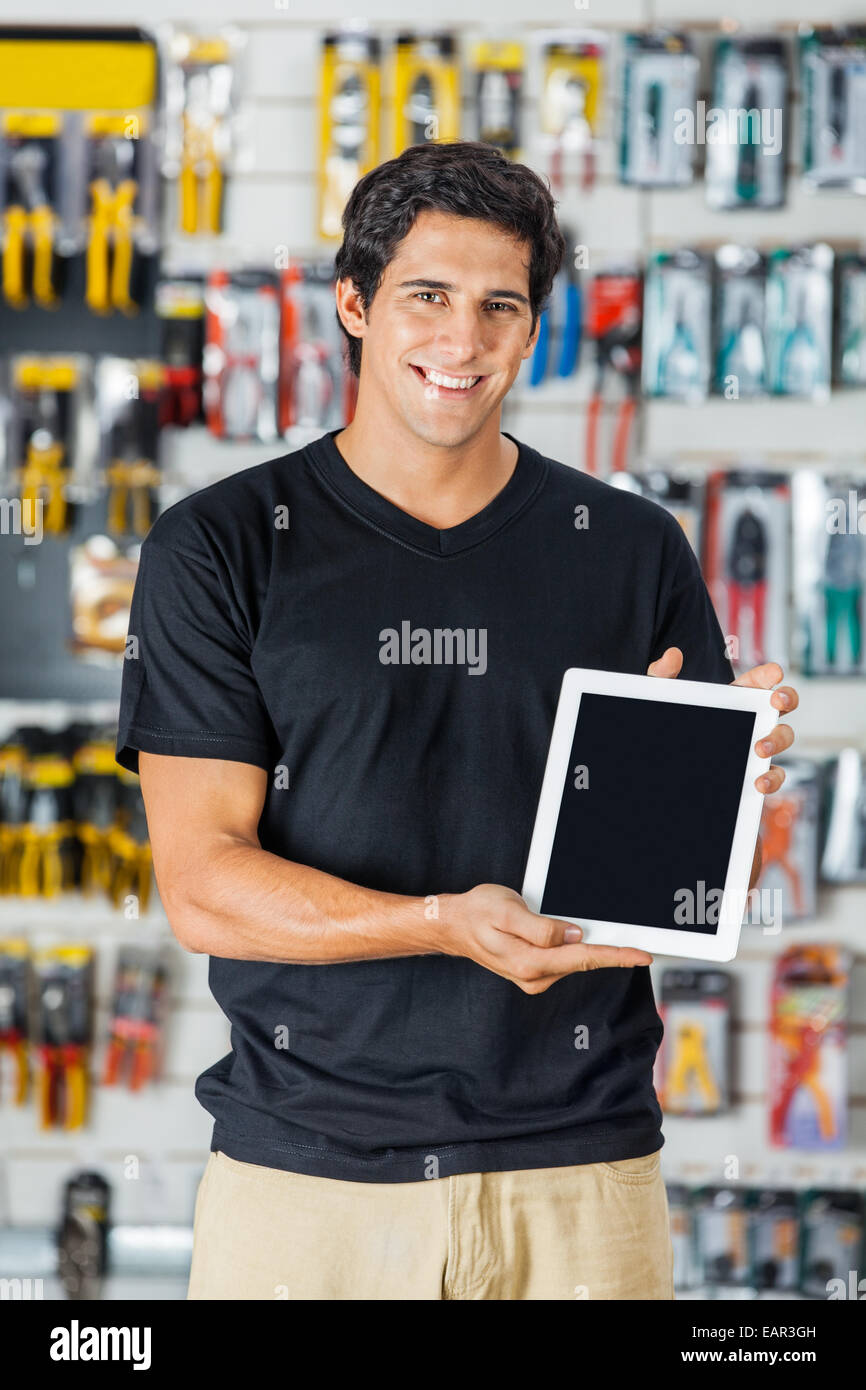 Smiling Man Presenting Digital Tablet In Hardware Store Stock Photo Alamy