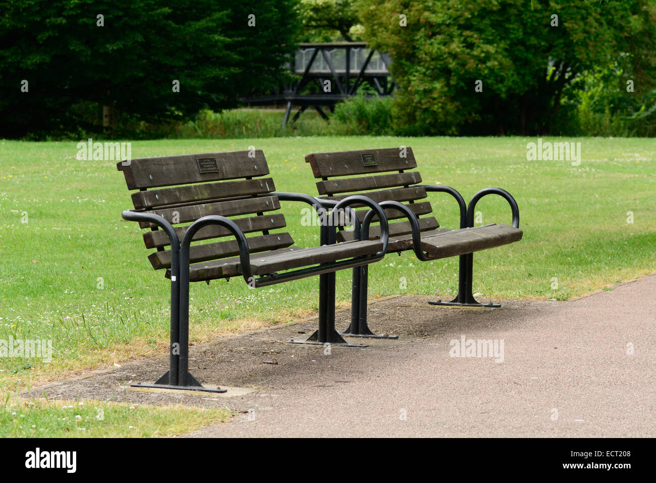 Two park benches side by side Stock Photo Alamy