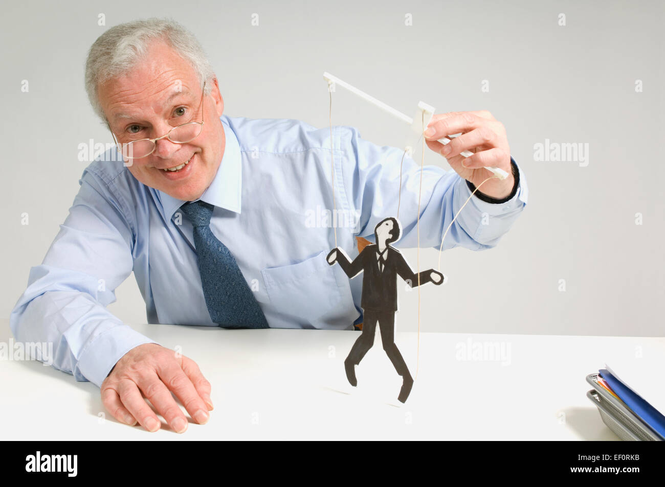 Man playing with a puppet Stock Photo Alamy