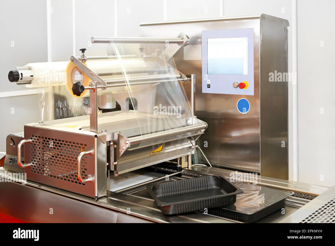 Foil packaging machine Stock Photo Alamy