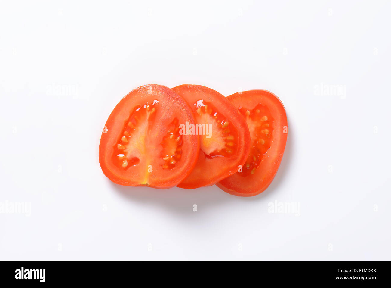 sliced tomato on white background Stock Photo Alamy