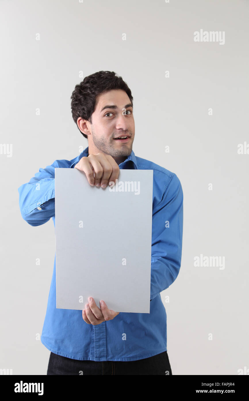 Picture Of A White Man Holding Paper at June Blackwell blog