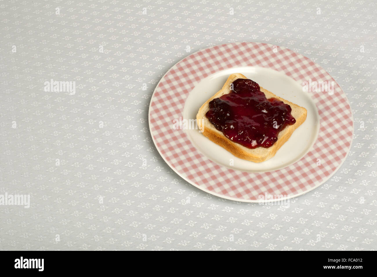 Spread jam on bread Stock Photo Alamy
