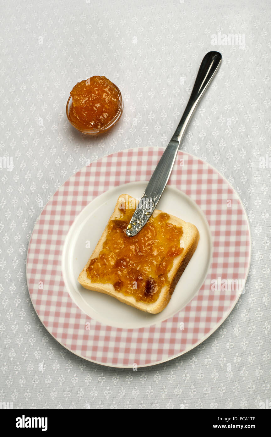 Spread jam on bread Stock Photo Alamy