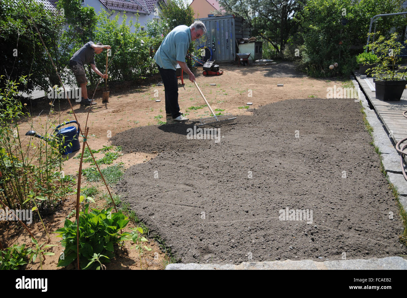 Laying sod, preparing soil Stock Photo Alamy