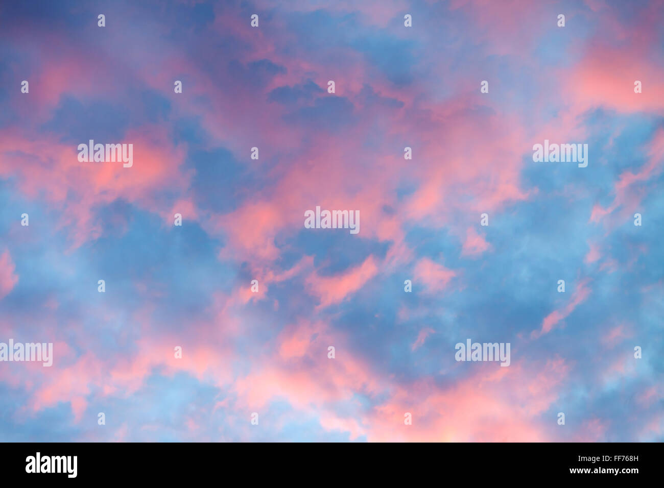 Sky clouds texture, background. Dramatic cotton candy sky cloud Stock