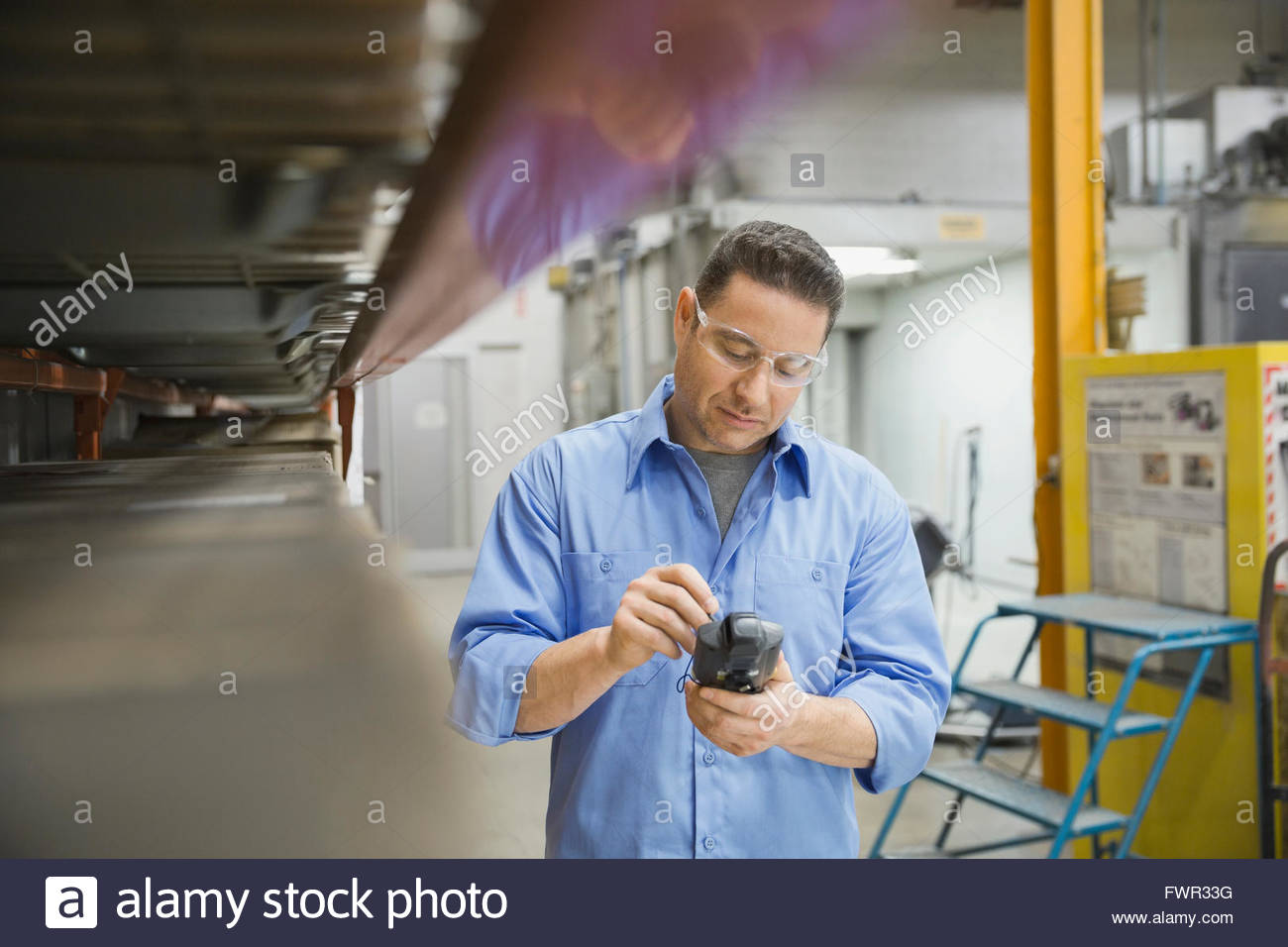 Worker using bar code reader in warehouse Stock Photo Alamy