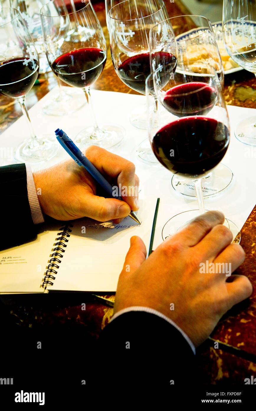 Wine taster writing notes Stock Photo Alamy