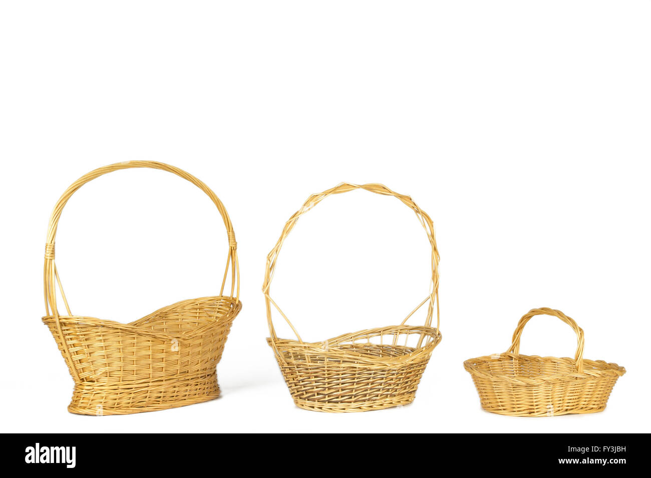 Yellow wicker baskets isolated on white. Horizontal format Stock Photo