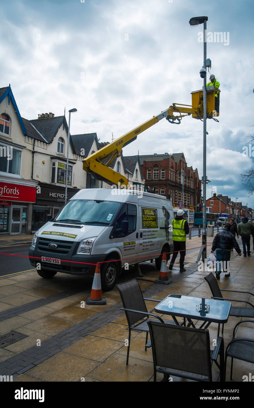 Visual Security Systems Contractors using a van mounted hydraulic hoist