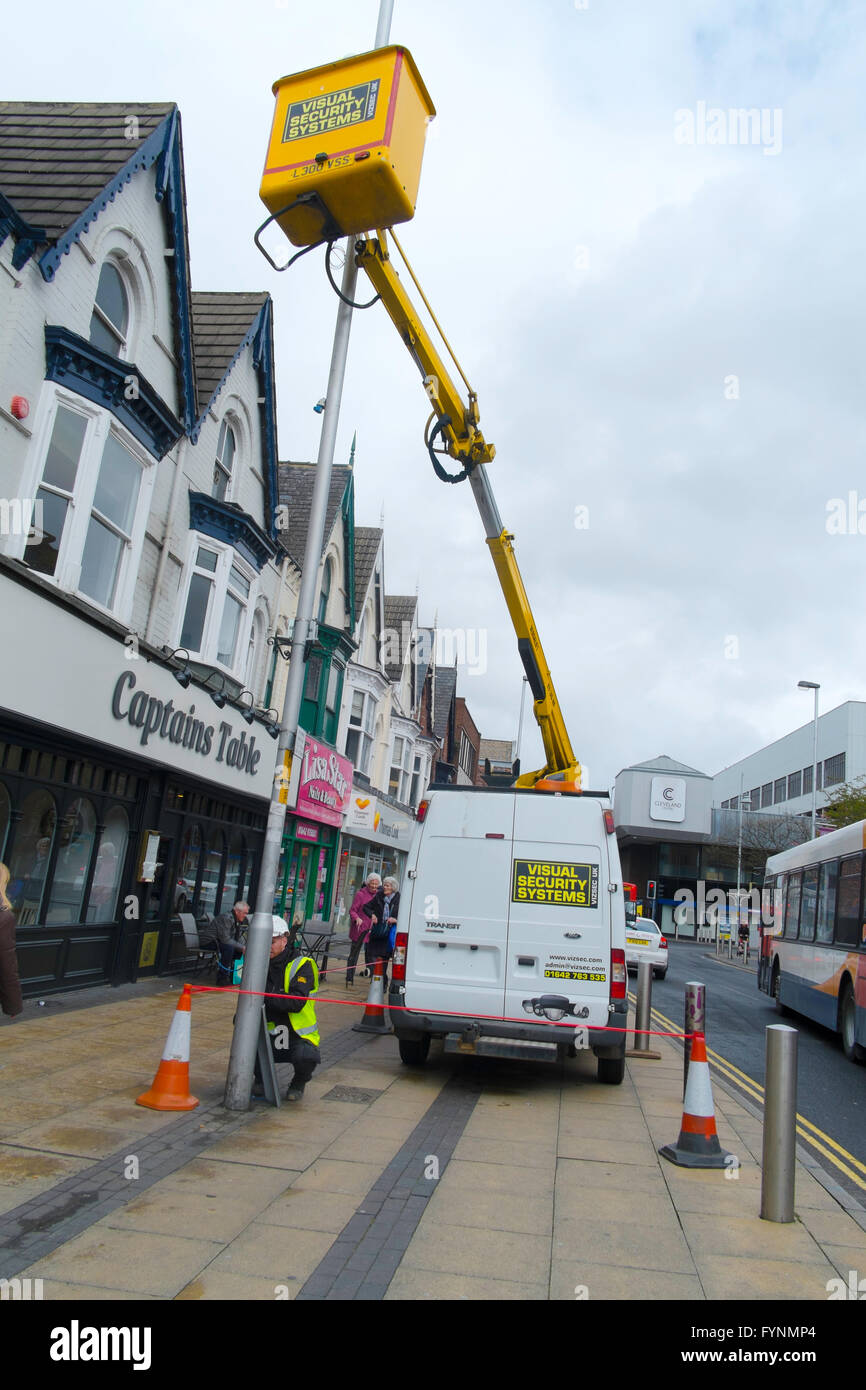 Visual Security Systems Contractors using a van mounted hydraulic hoist