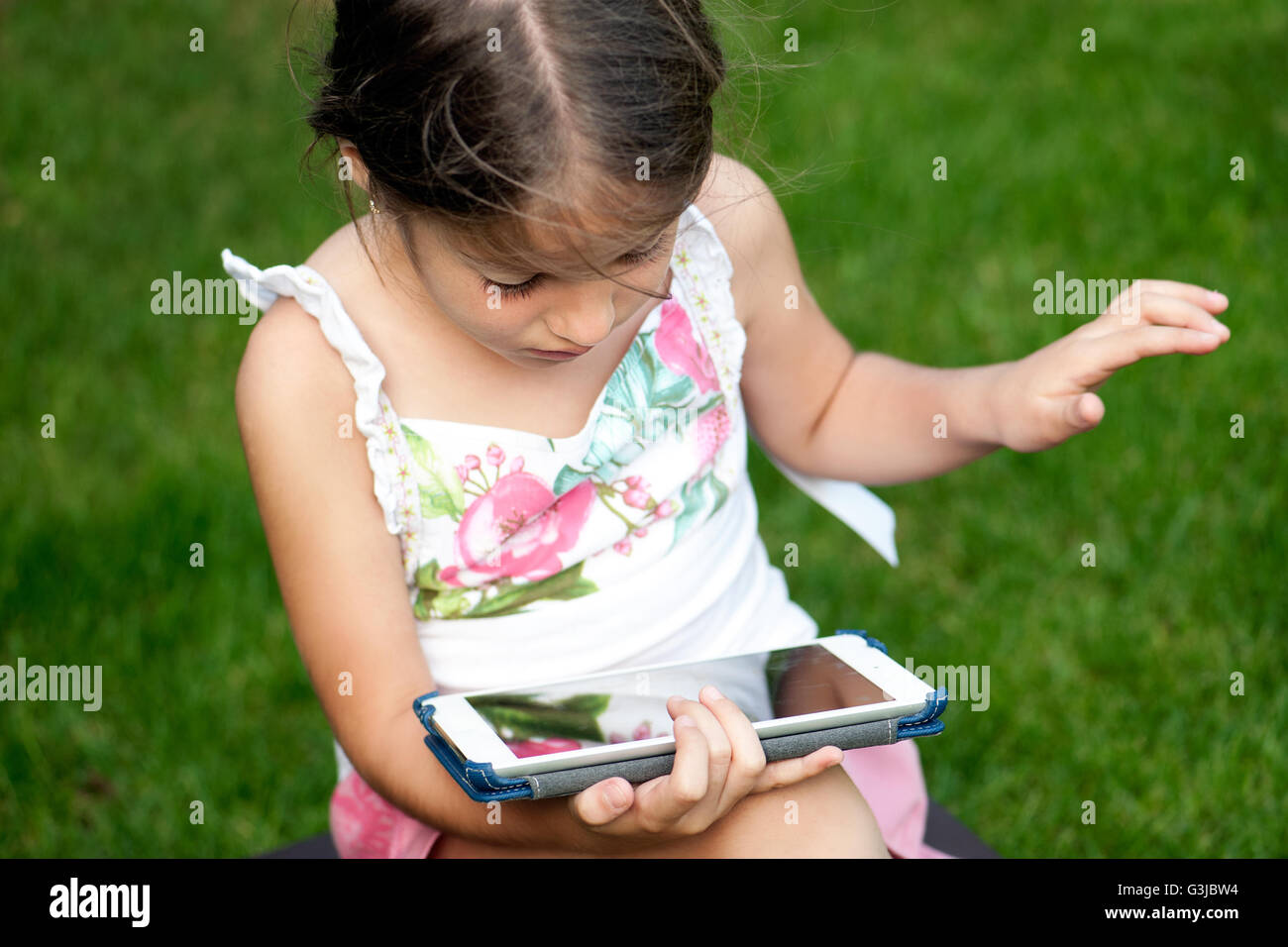 Little girl using tablet Stock Photo Alamy