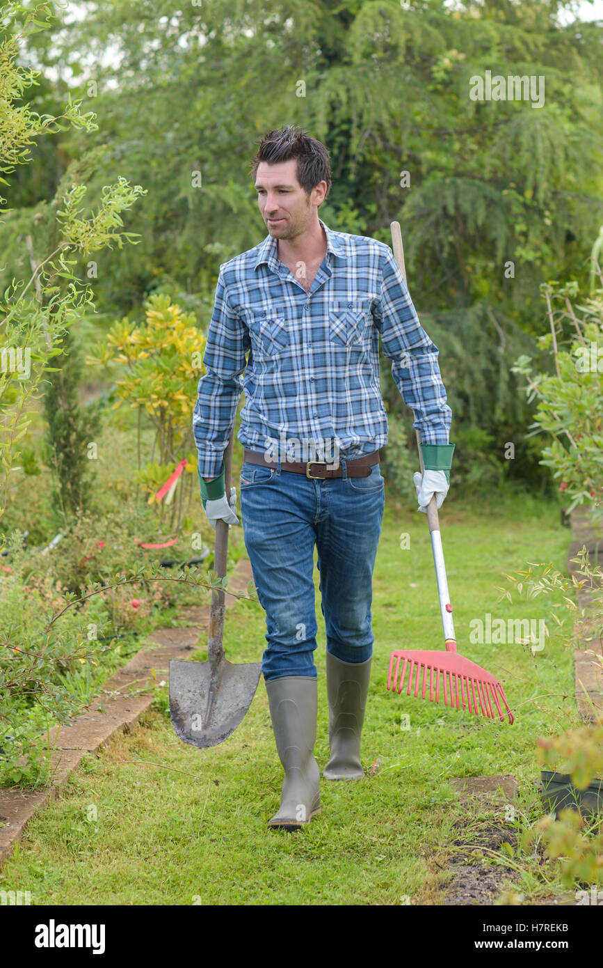 bringing spade and rake Stock Photo Alamy